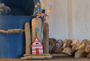 Red Beach Hut on Driftwood