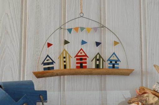 Five Coloured Beach Huts On Driftwood 1